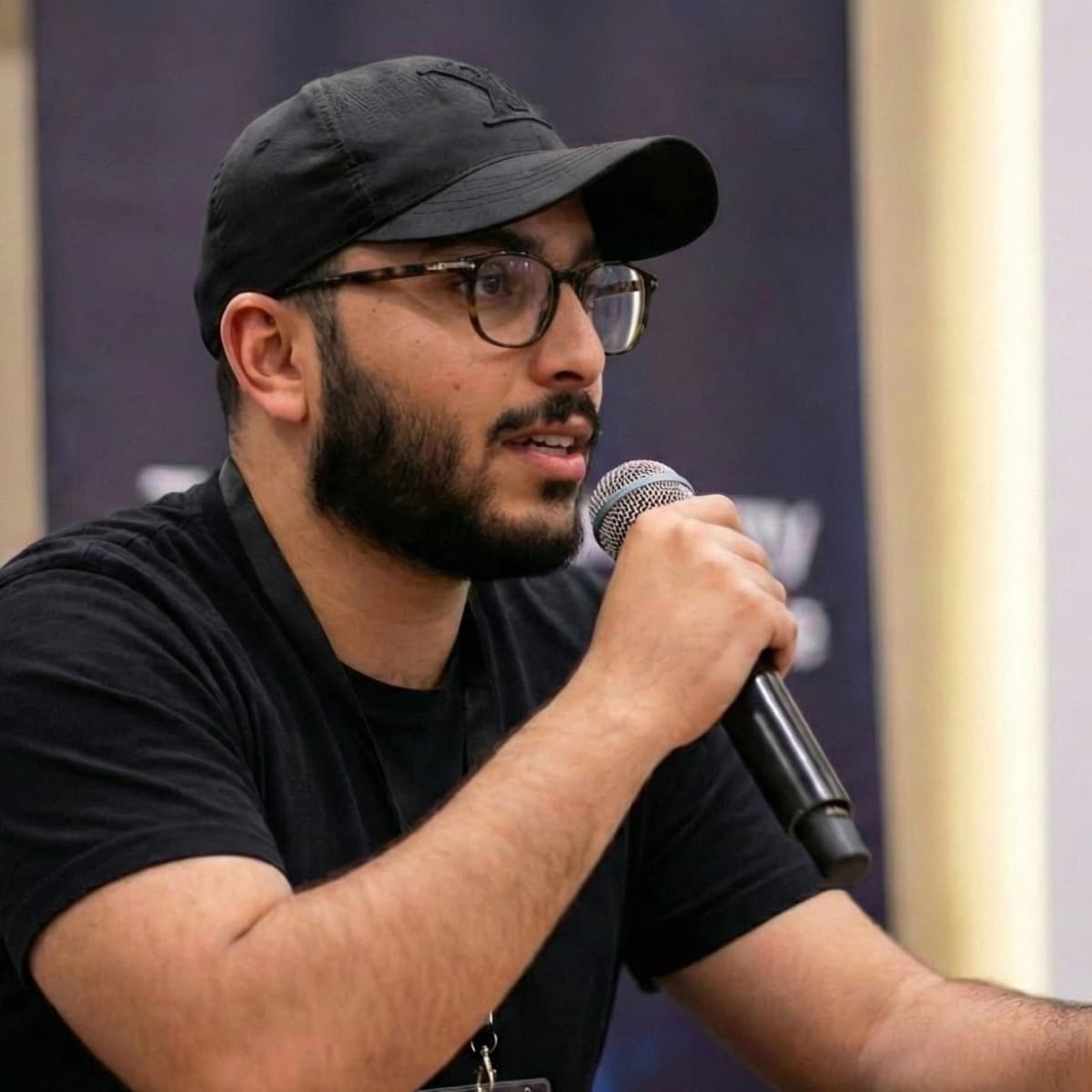 Portrait of Salaheddine Benouda speaking at a tech event